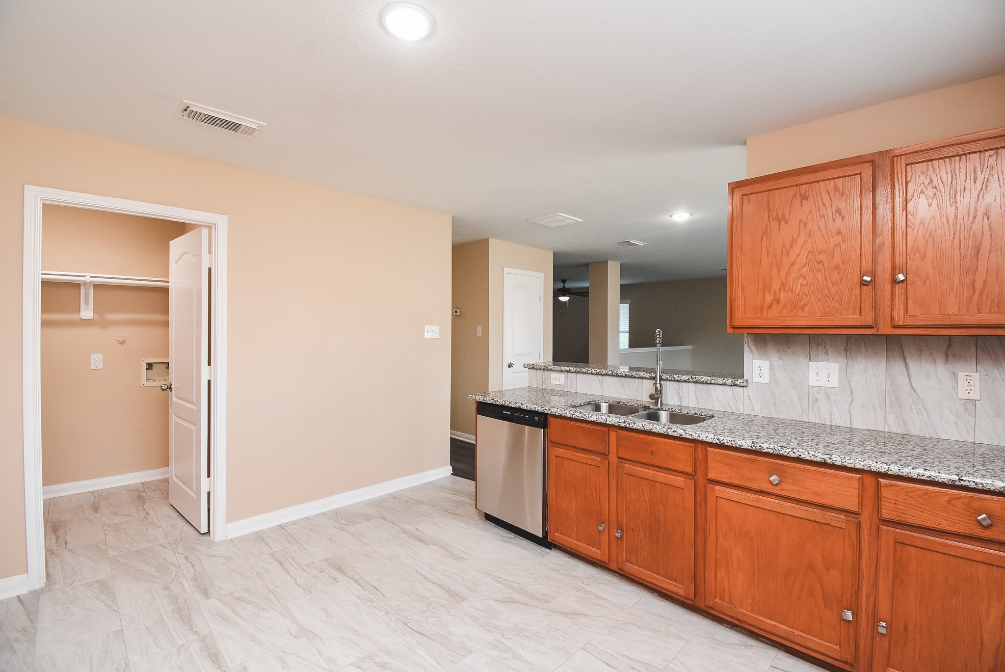 20815 Baronsledge Lane Katy, TX 77449 - Photo 14 of 31 a view of a kitchen with stainless steel appliances granite countertop a sink and cabinets