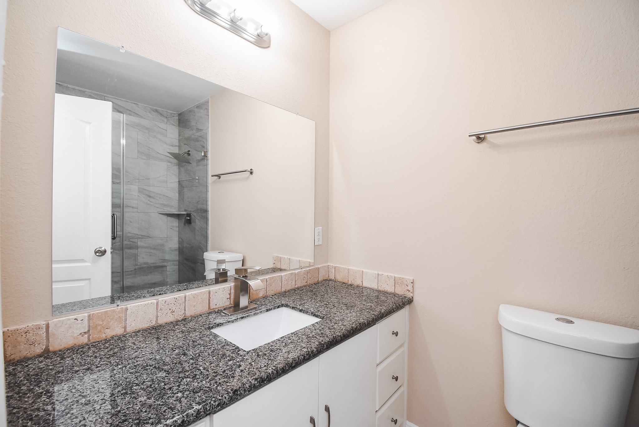 20815 Baronsledge Lane Katy, TX 77449 - Photo 17 of 31 a bathroom with a granite countertop sink and a mirror