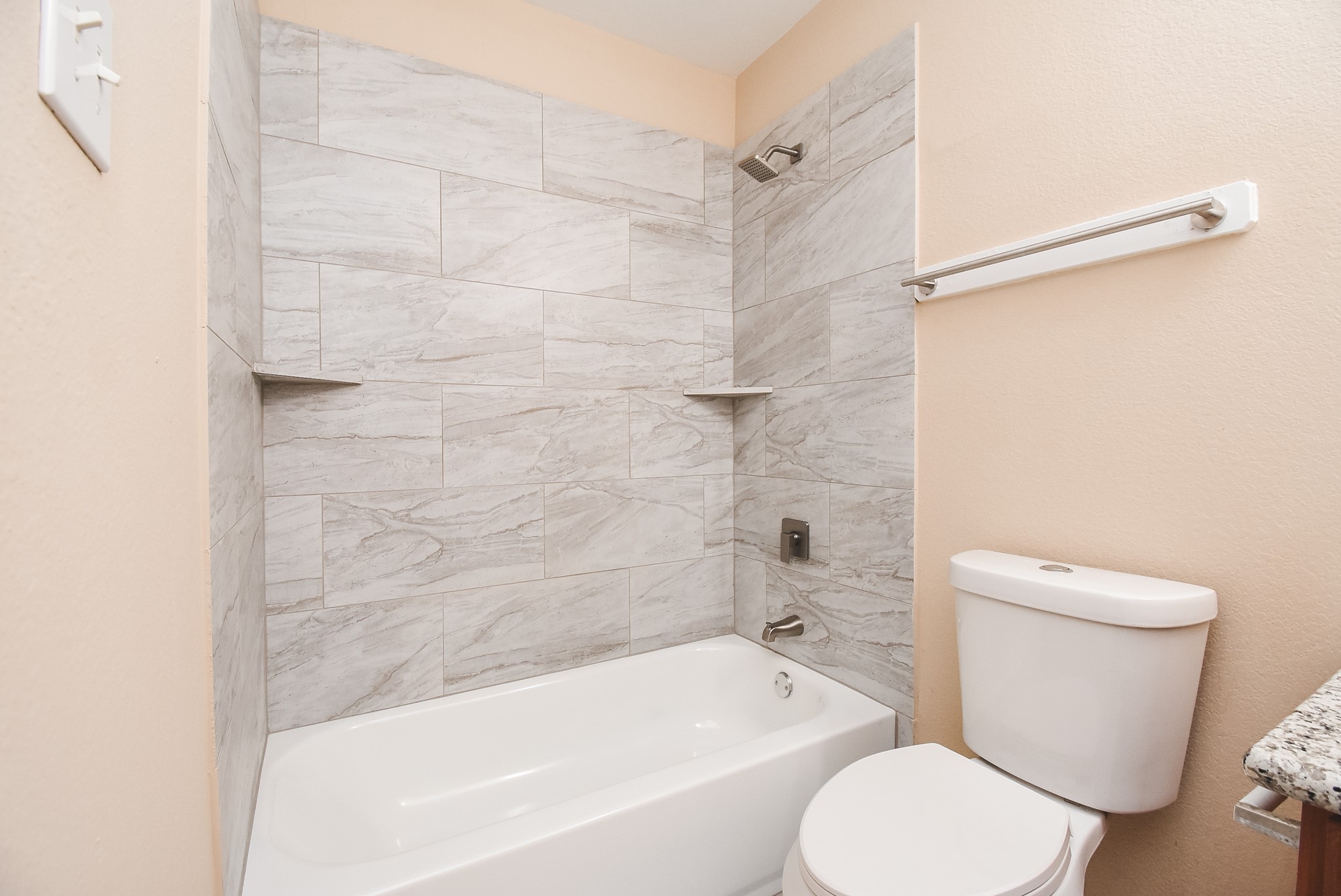 20815 Baronsledge Lane Katy, TX 77449 - Photo 28 of 31 a bathroom with a toilet and a bathtub
