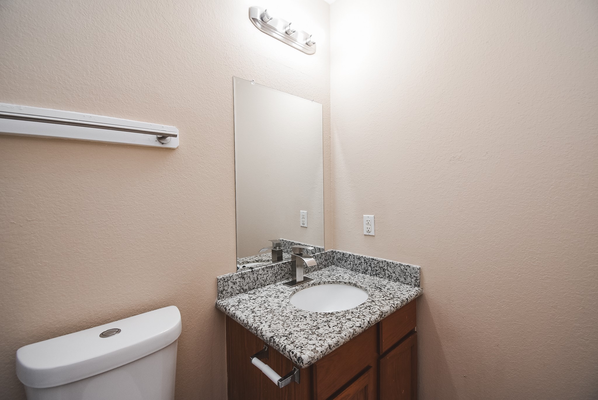 20815 Baronsledge Lane Katy, TX 77449 - Photo 29 of 31 a bathroom with a granite countertop sink and a toilet