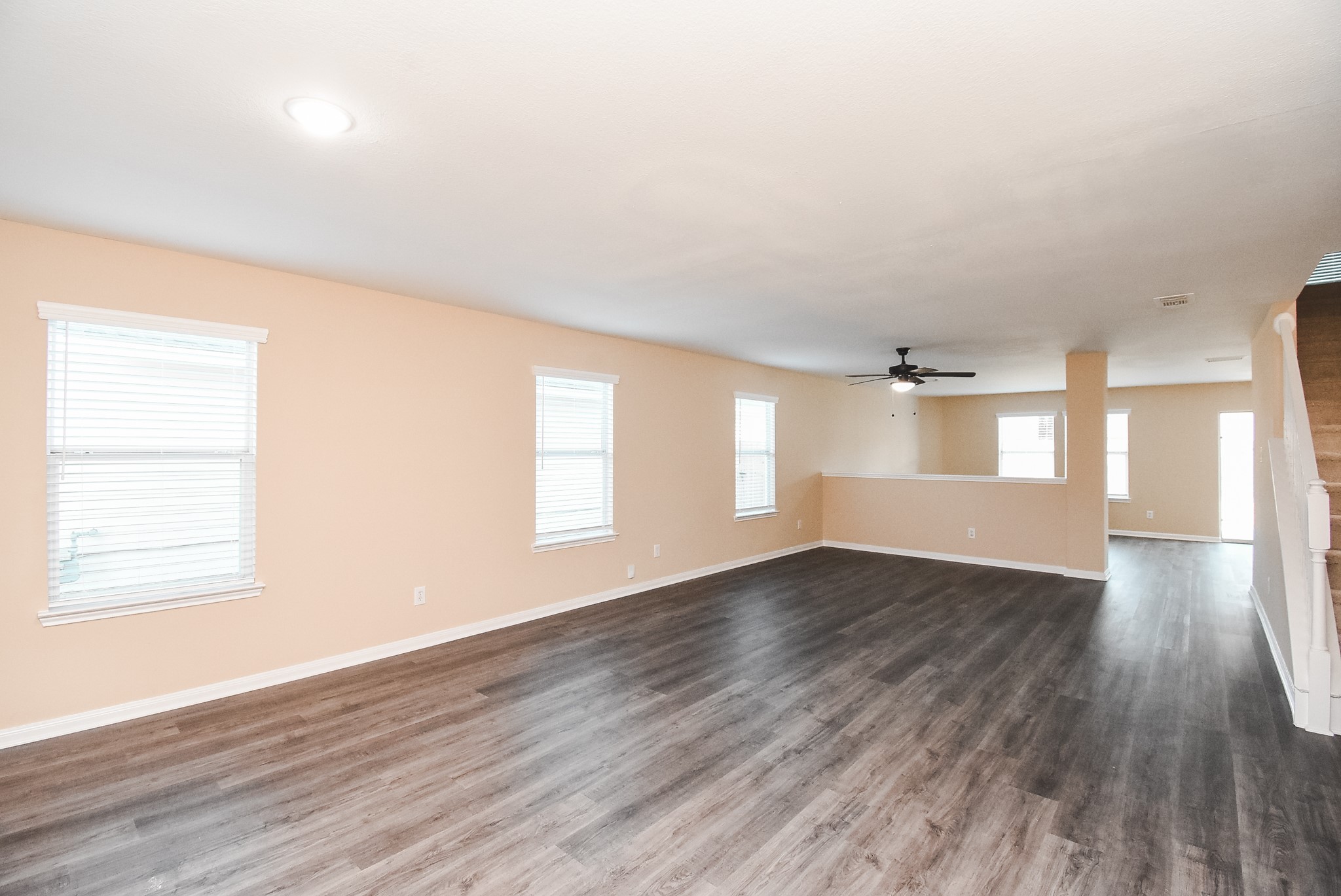 20815 Baronsledge Lane Katy, TX 77449 - Photo 3 of 31 an empty room with wooden floor and windows