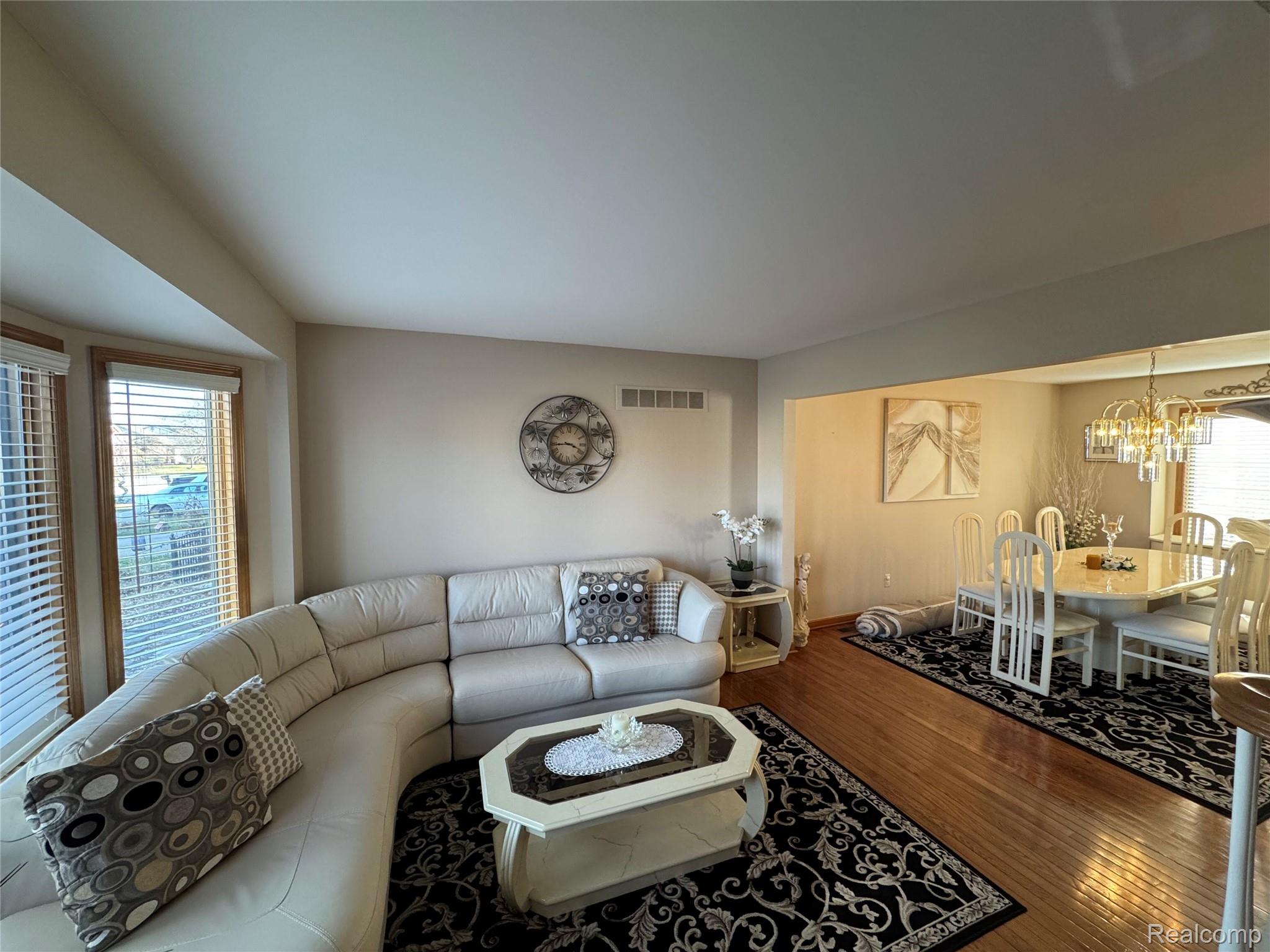48583 Tilch Road Macomb, MI 48044 - Photo 21 of 53 Living area with dark wood-type flooring and hanging lights