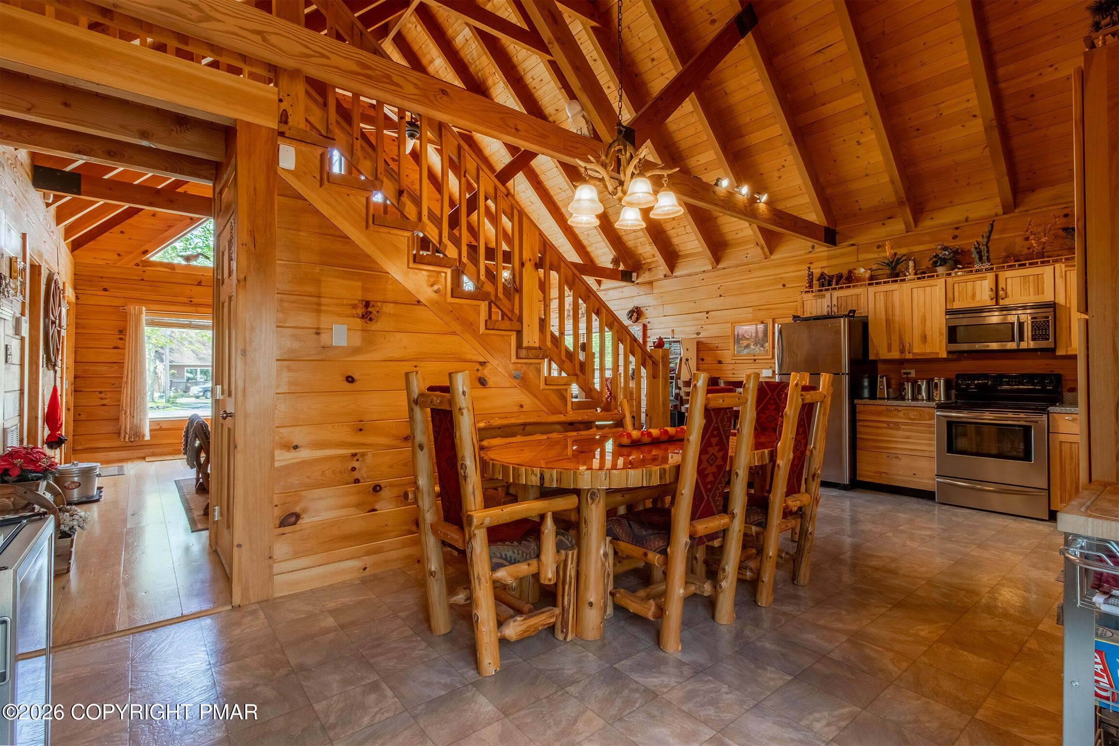 1160 Bluebird Lane Bushkill, PA 18324 - Photo 13 of 44 a view of a room with lots of wooden furniture and stainless steel appliances