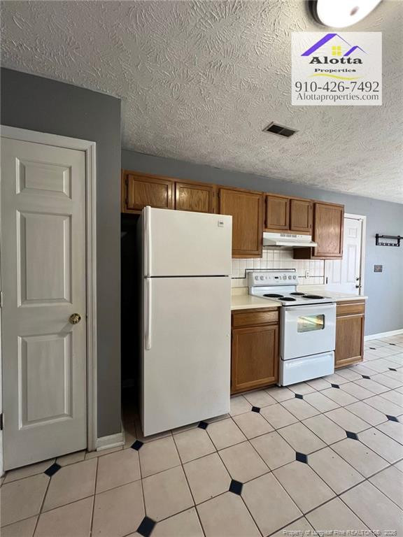 732 Rim Road Fayetteville, NC 28314 - Photo 12 of 17 a kitchen with appliances cabinets and counter
