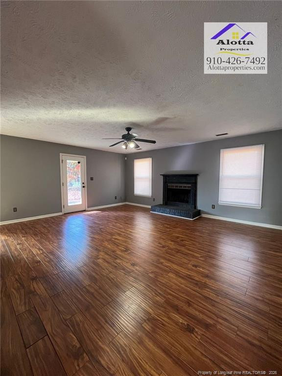 732 Rim Road Fayetteville, NC 28314 - Photo 14 of 17 an empty room with windows and a fireplace