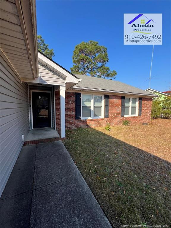 732 Rim Road Fayetteville, NC 28314 - Photo 15 of 17 a view of a house with a yard