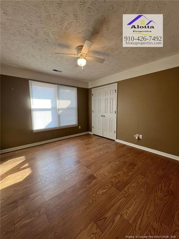 732 Rim Road Fayetteville, NC 28314 - Photo 16 of 17 an empty room with wooden floor and windows