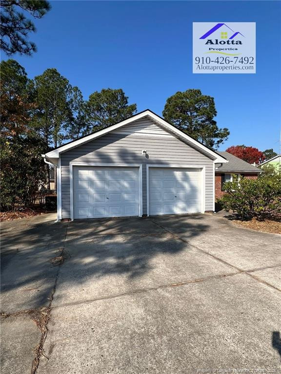 732 Rim Road Fayetteville, NC 28314 - Photo 17 of 17 a front view of a house with a yard and garage
