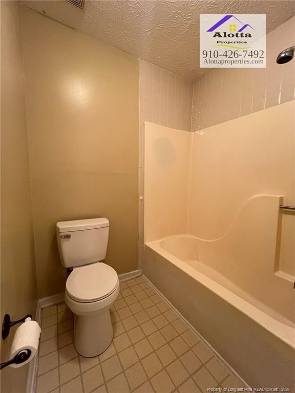 732 Rim Road Fayetteville, NC 28314 - Photo 4 of 17 a bathroom with a toilet and a bathtub