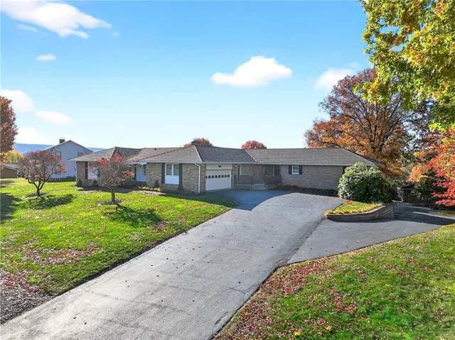 a view of multiple houses with a yard
