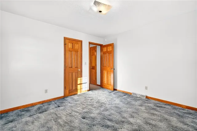 a bathroom with a double vanity sink mirror and toilet