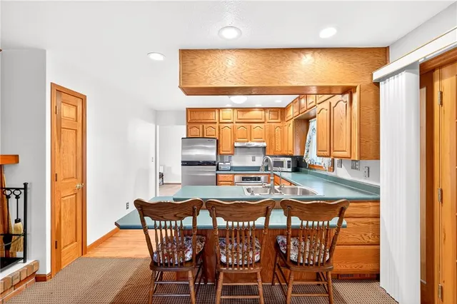 a view of an entryway with wooden floor