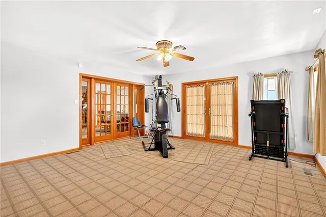 a bathroom with a toilet shower vanity and a sink
