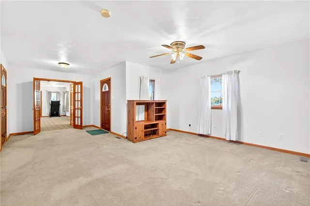 a kitchen with stainless steel appliances a refrigerator sink and cabinets