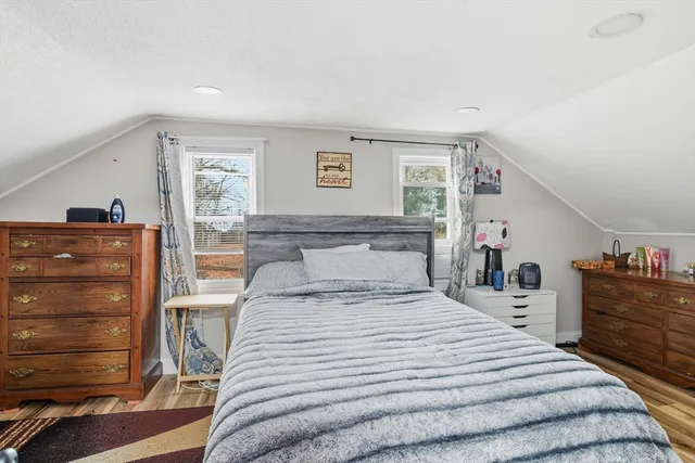 a bedroom with a bed and a dresser