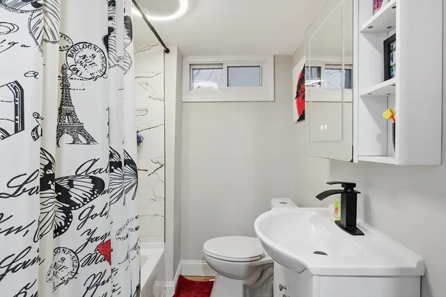 a bathroom with a toilet and a sink