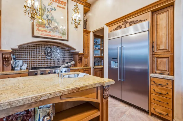 a kitchen with a refrigerator and countertop