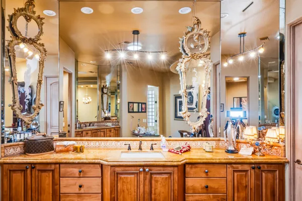 a bathroom with a sink and a large mirror