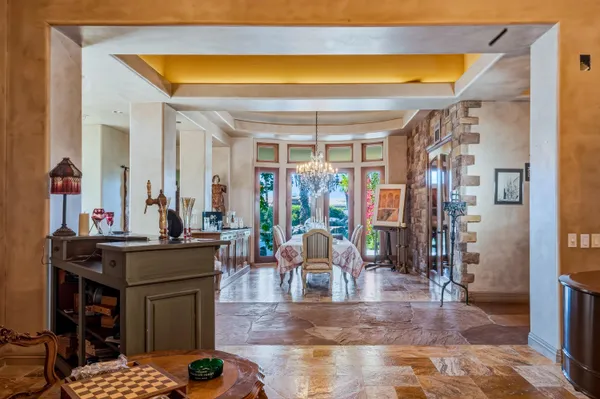 a living room with a table and chairs