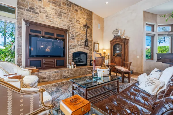 a living room with fireplace furniture and a fireplace