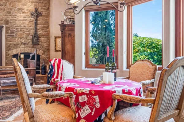a bedroom with furniture and a large window