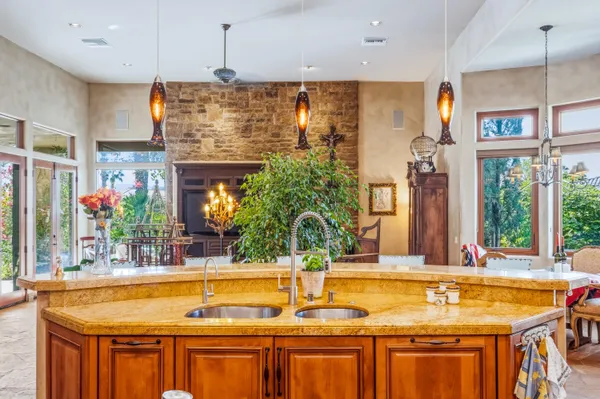 a view of a house with swimming pool and furniture