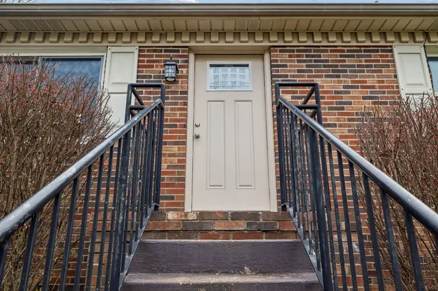 a view of a balcony with wooden floor and stairs