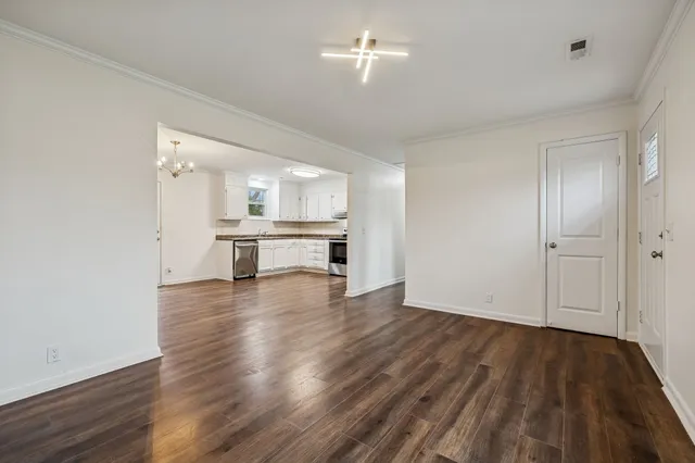 a view of kitchen with furniture and wooden floor