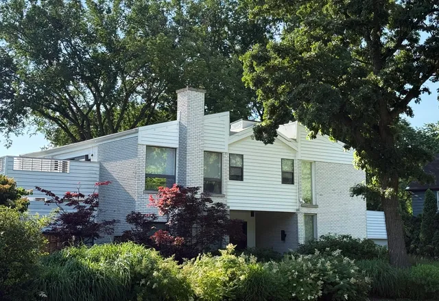 a front view of house with garden