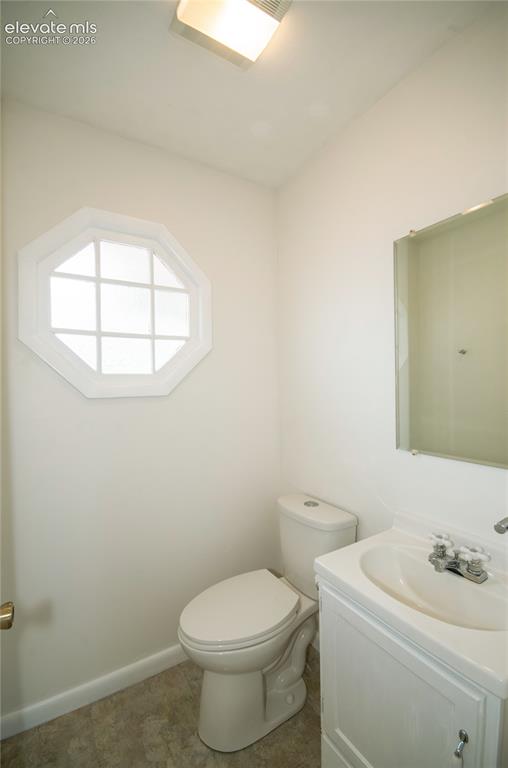 4710 Limestone Road Monument, CO 80132 - Photo 5 of 50 a white toilet sitting next to a bathroom sink