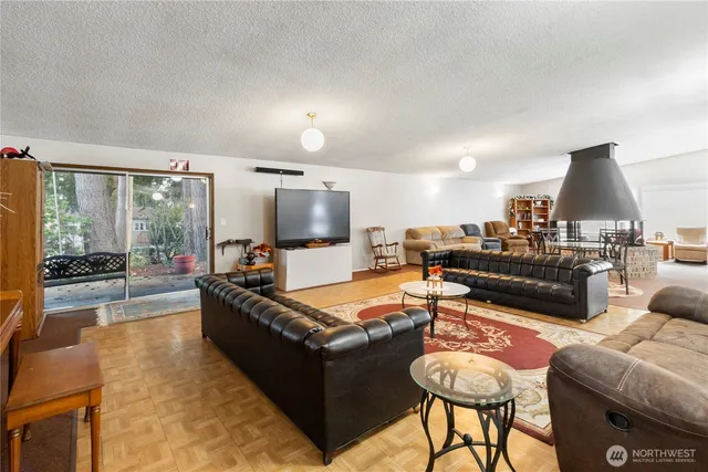 a view of a workspace with furniture and a bookshelf