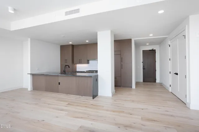 a view of an empty room with glass door