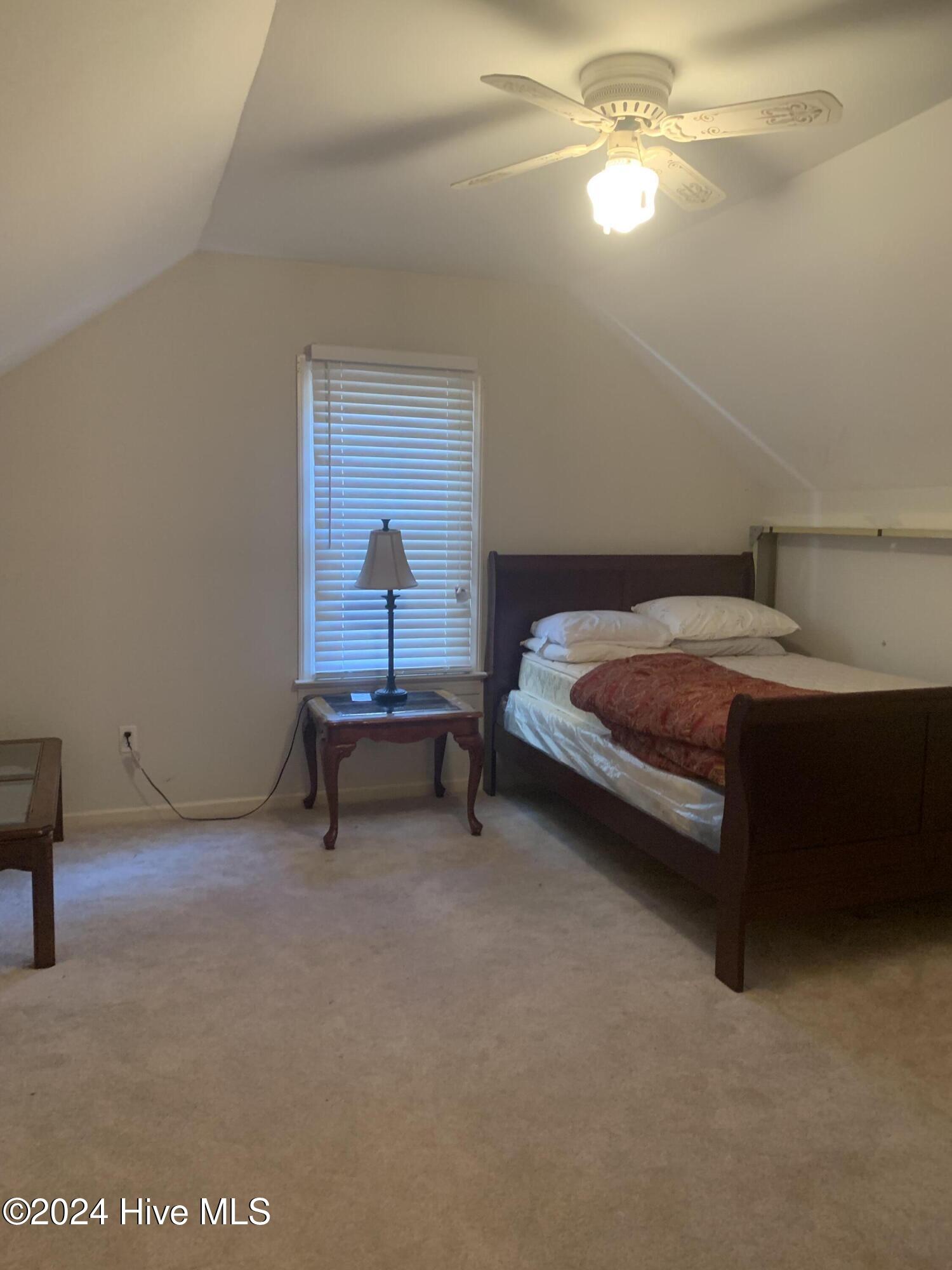 1712 Ridgeway Street West Wilson, NC 27893 - Photo 36 of 55 Upstairs right side bedroom. New paint and carpet. Spacious room with double closet.