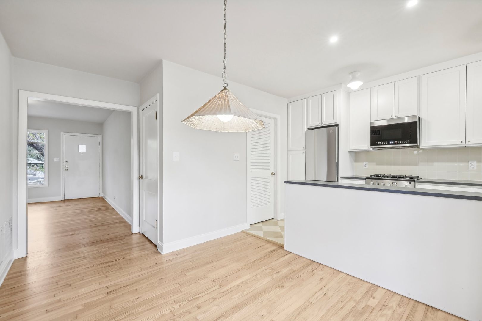 3010 Windsor Road, Unit E Austin, TX 78703 - Photo 8 of 17 a view of a kitchen with a sink and a refrigerator