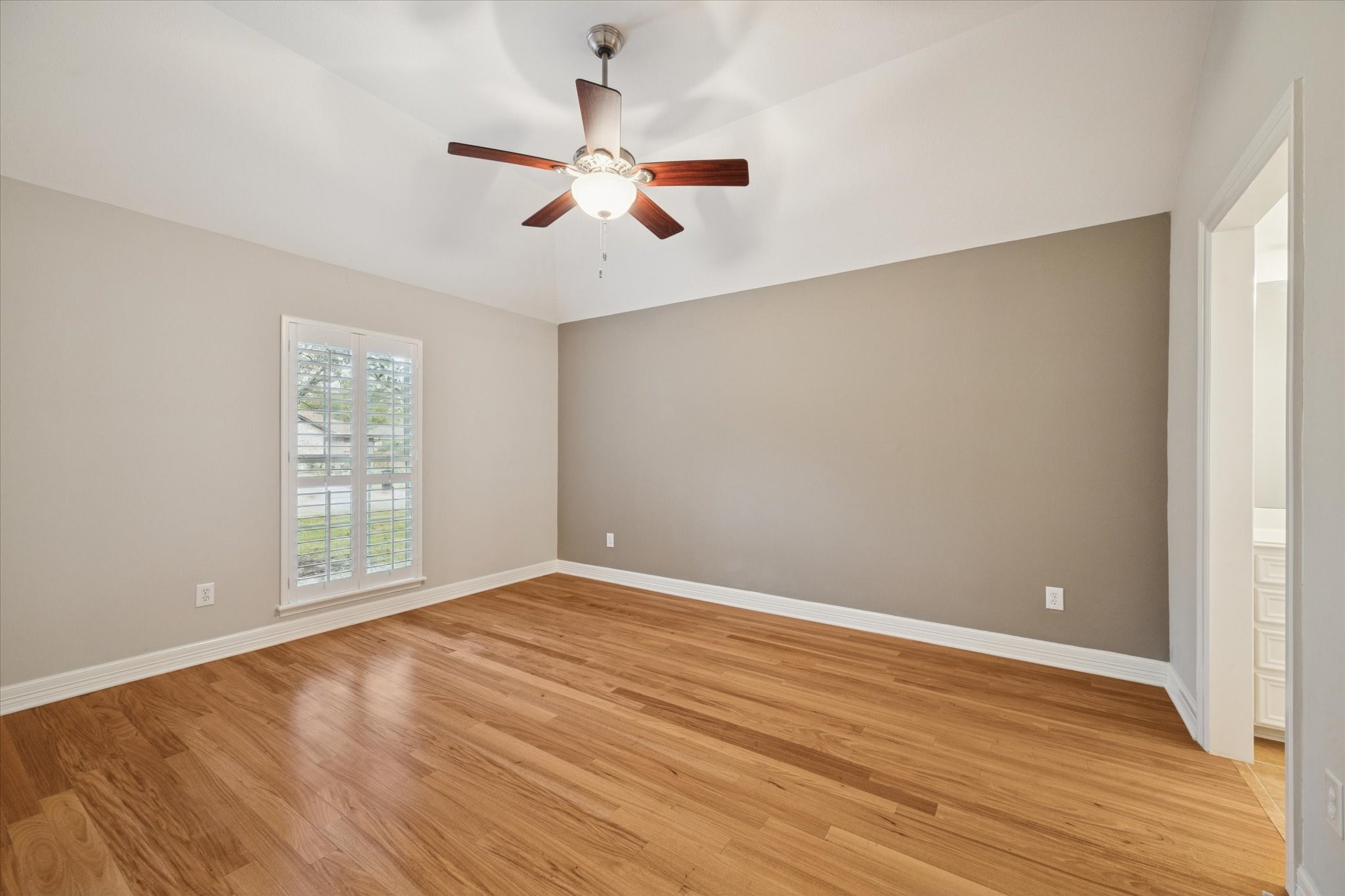 304 Scenic View Friendswood, TX 77546 - Photo 22 of 41 a view of an empty room with wooden floor and a window
