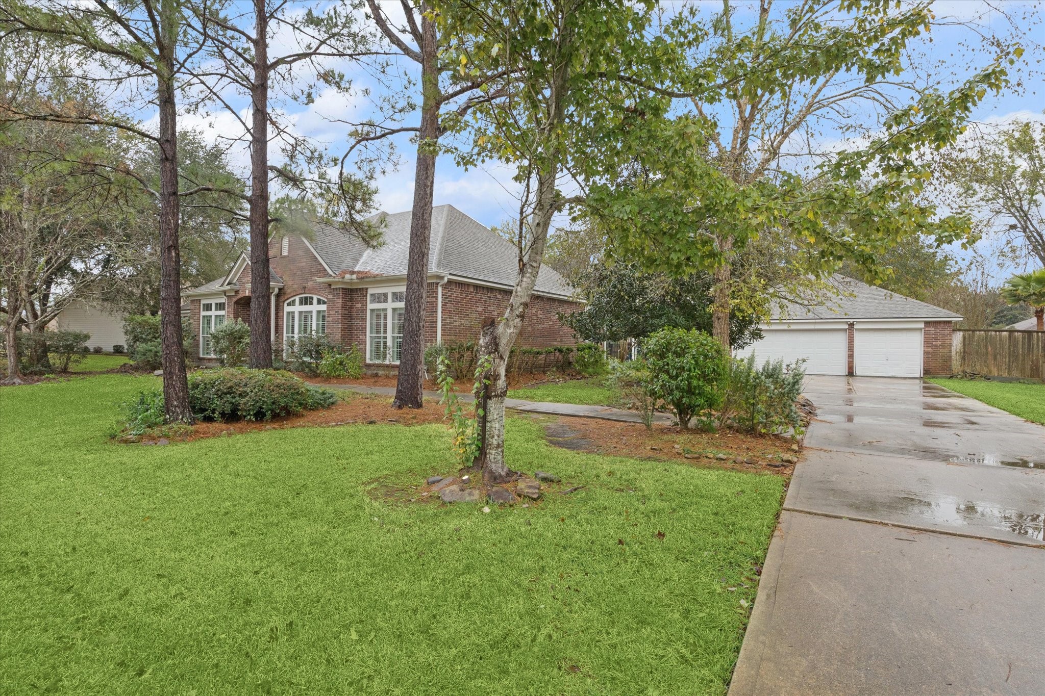 304 Scenic View Friendswood, TX 77546 - Photo 4 of 41 Detached 3 car garage has an extra climate-controlled space and a 1/2 bath for anything YOU need it for!