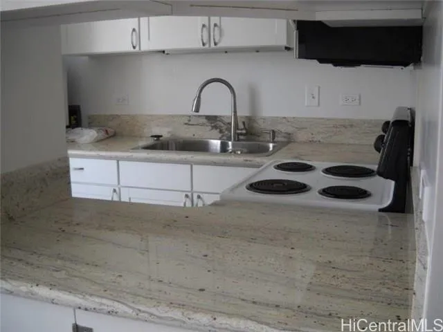 a kitchen with a stove and a microwave