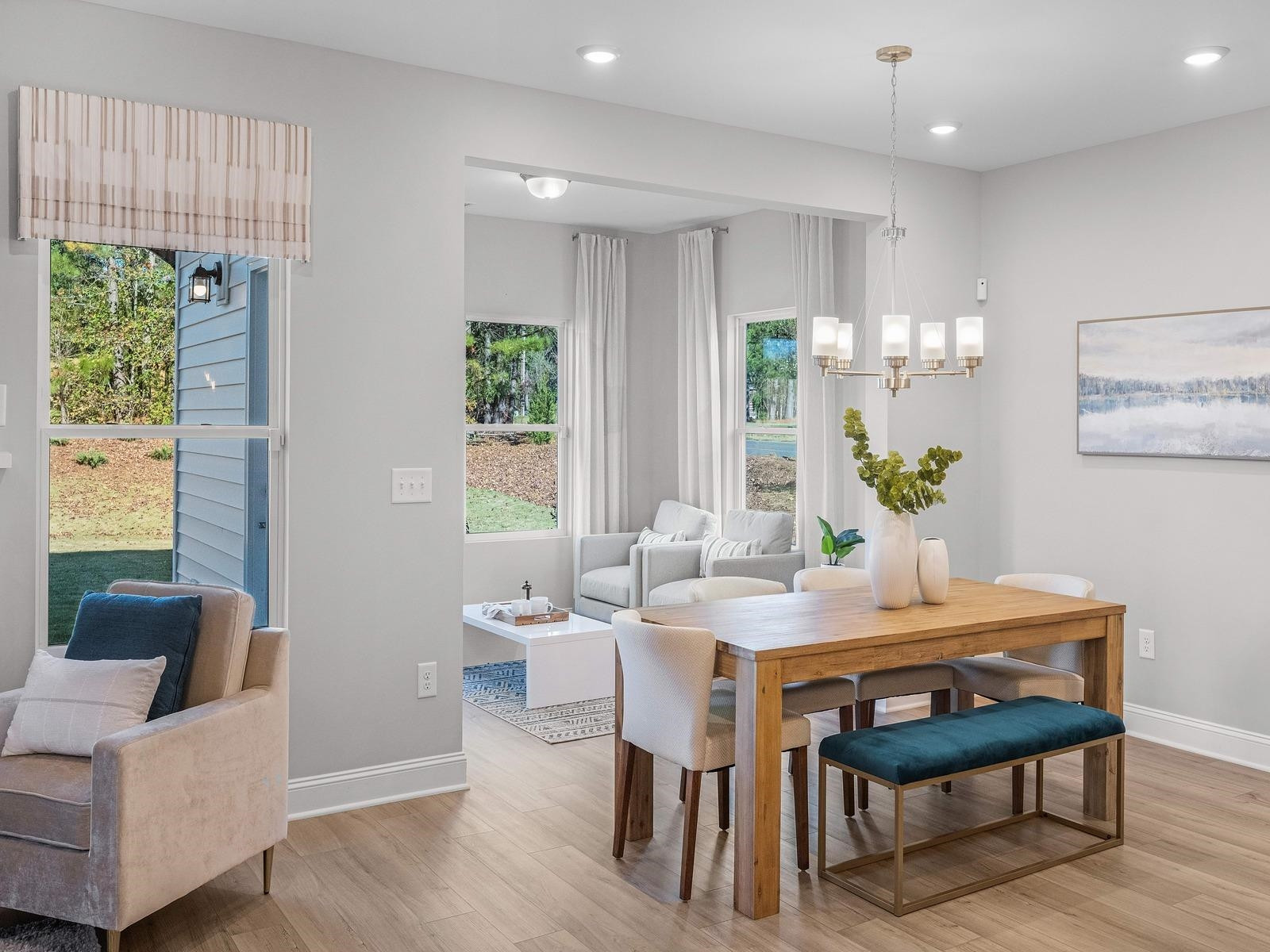 8317 Aldous Way Raleigh, NC 27616 - Photo 3 of 16 a view of a dining room with furniture window and wooden floor