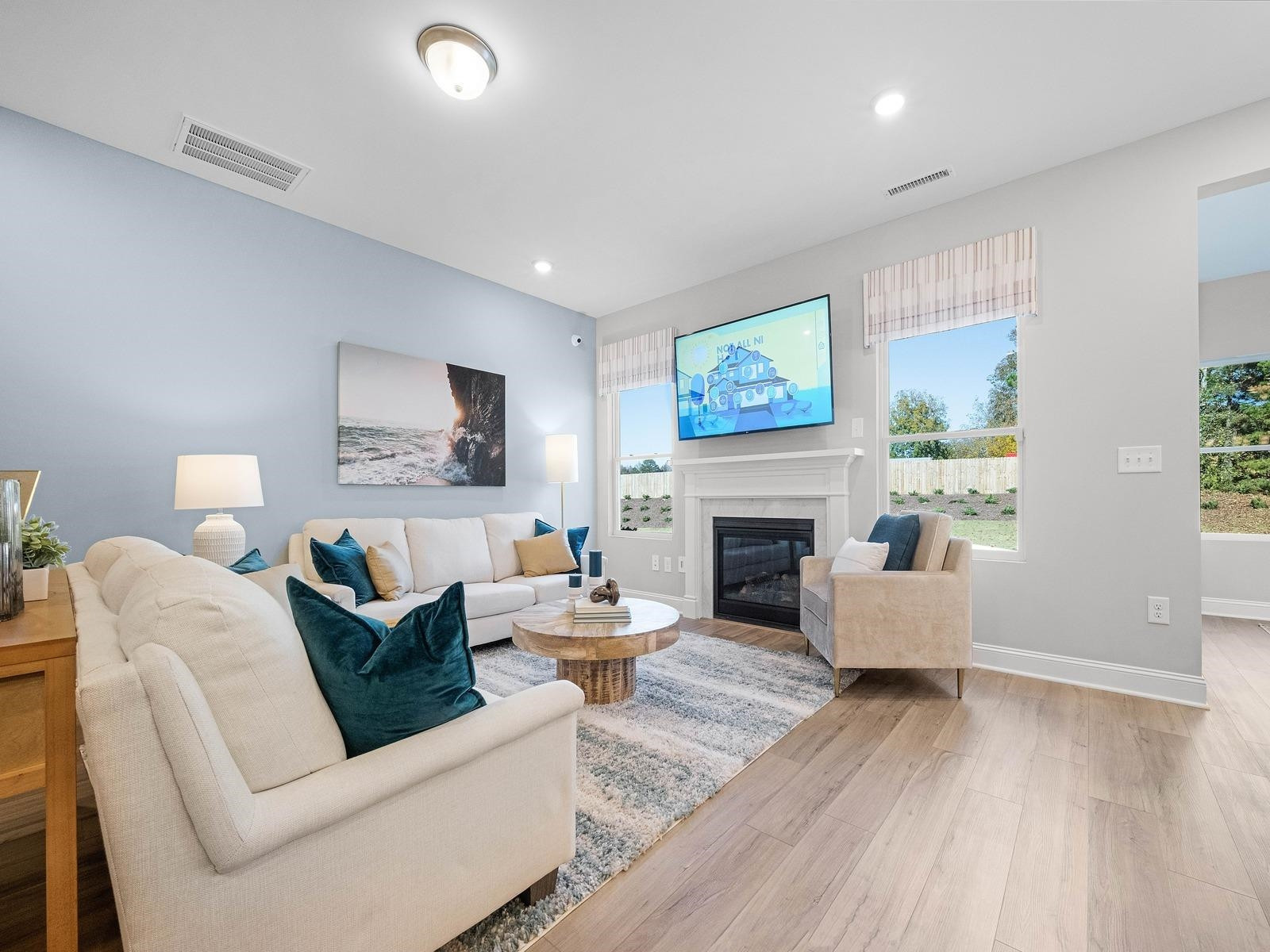 8317 Aldous Way Raleigh, NC 27616 - Photo 4 of 16 a living room with furniture and a fireplace