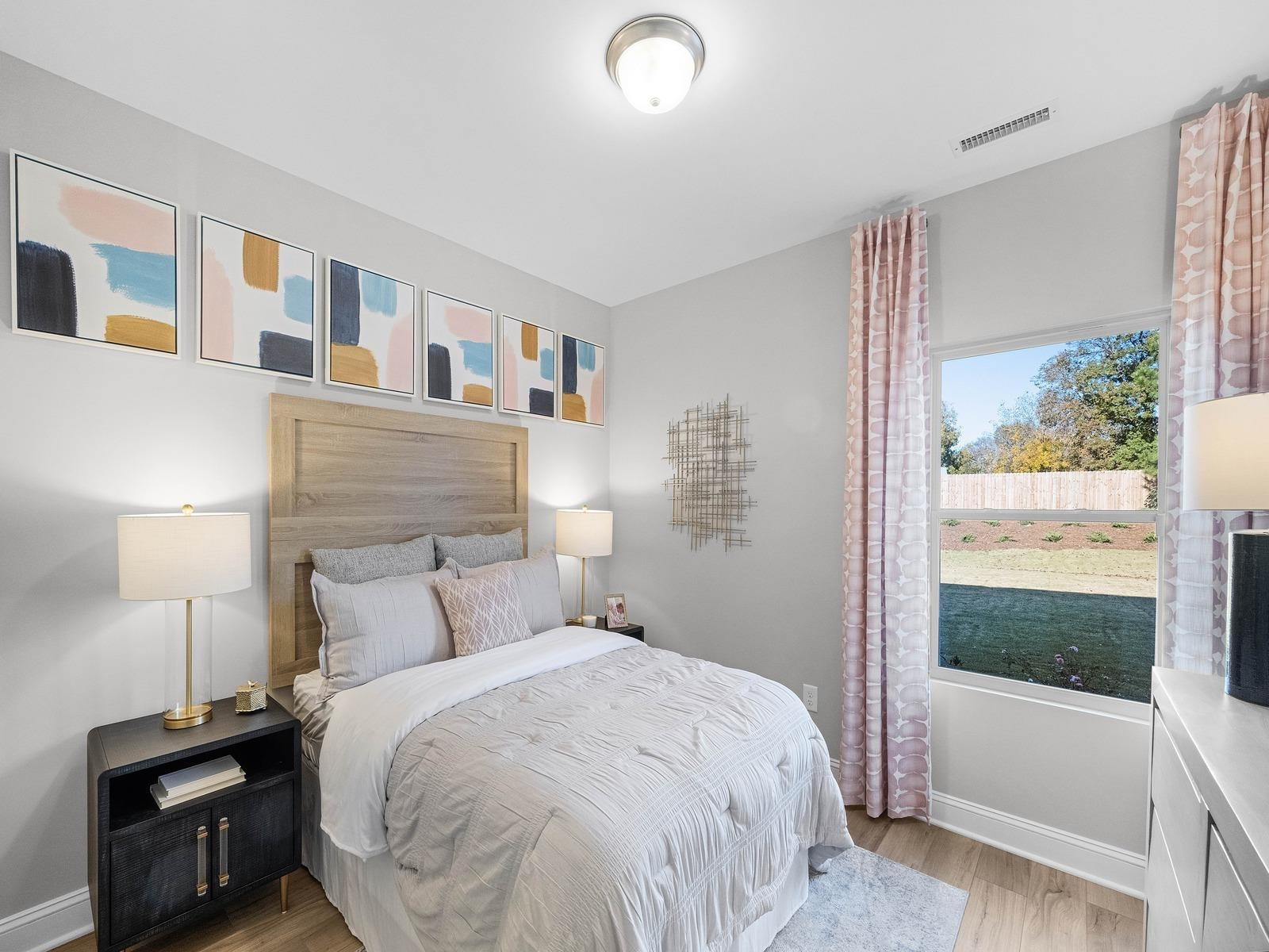 8317 Aldous Way Raleigh, NC 27616 - Photo 5 of 16 a bedroom with a bed and a window