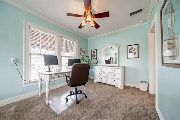 a view of workspace with wooden floor windows