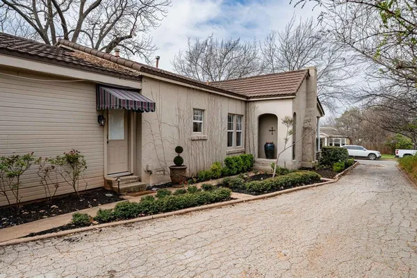 a front view of a house with garden