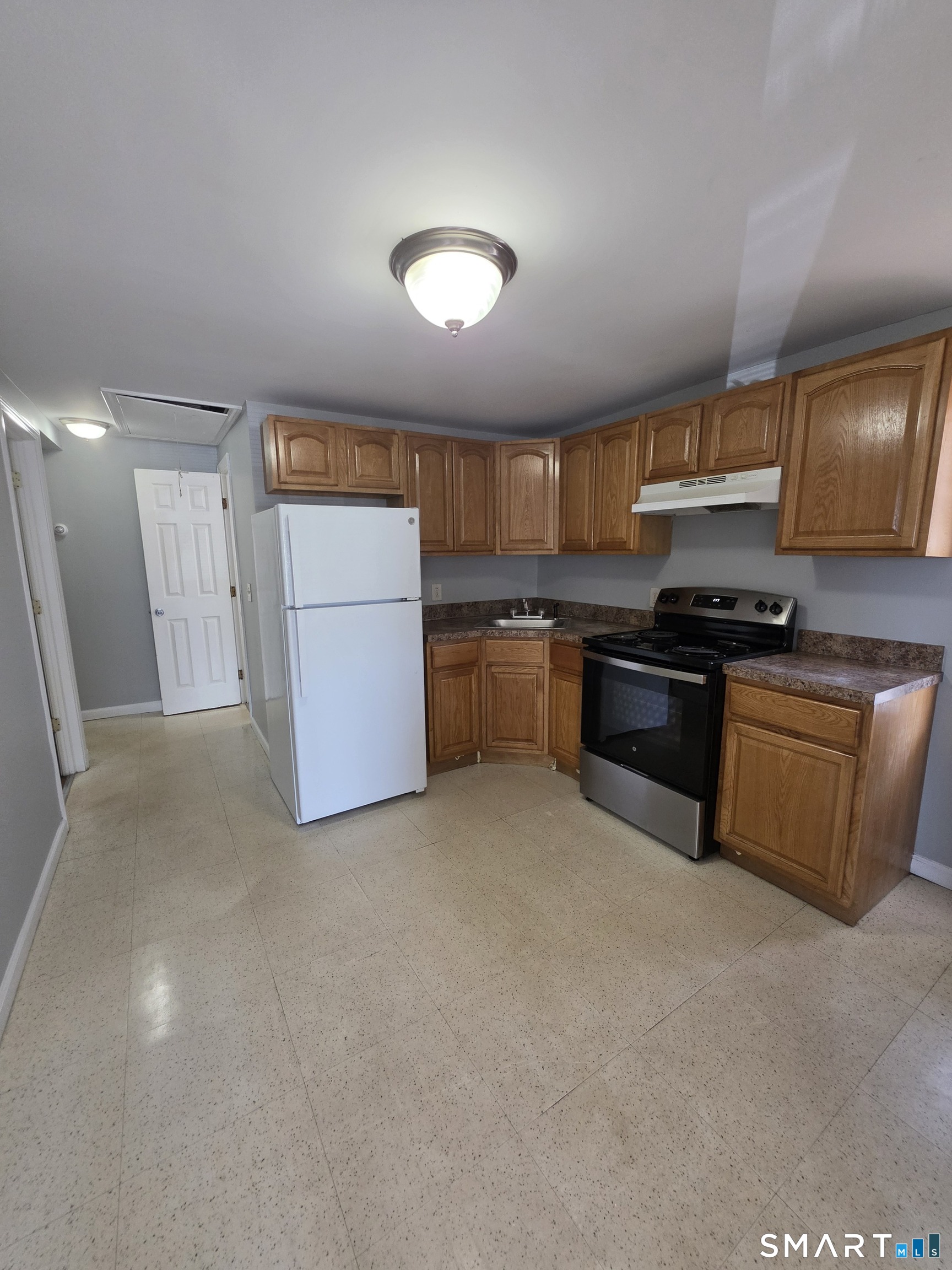 8 Mannz Street Hartford, CT 06114 - Photo 1 of 22 a kitchen with stainless steel appliances granite countertop a stove a sink dishwasher and a refrigerator
