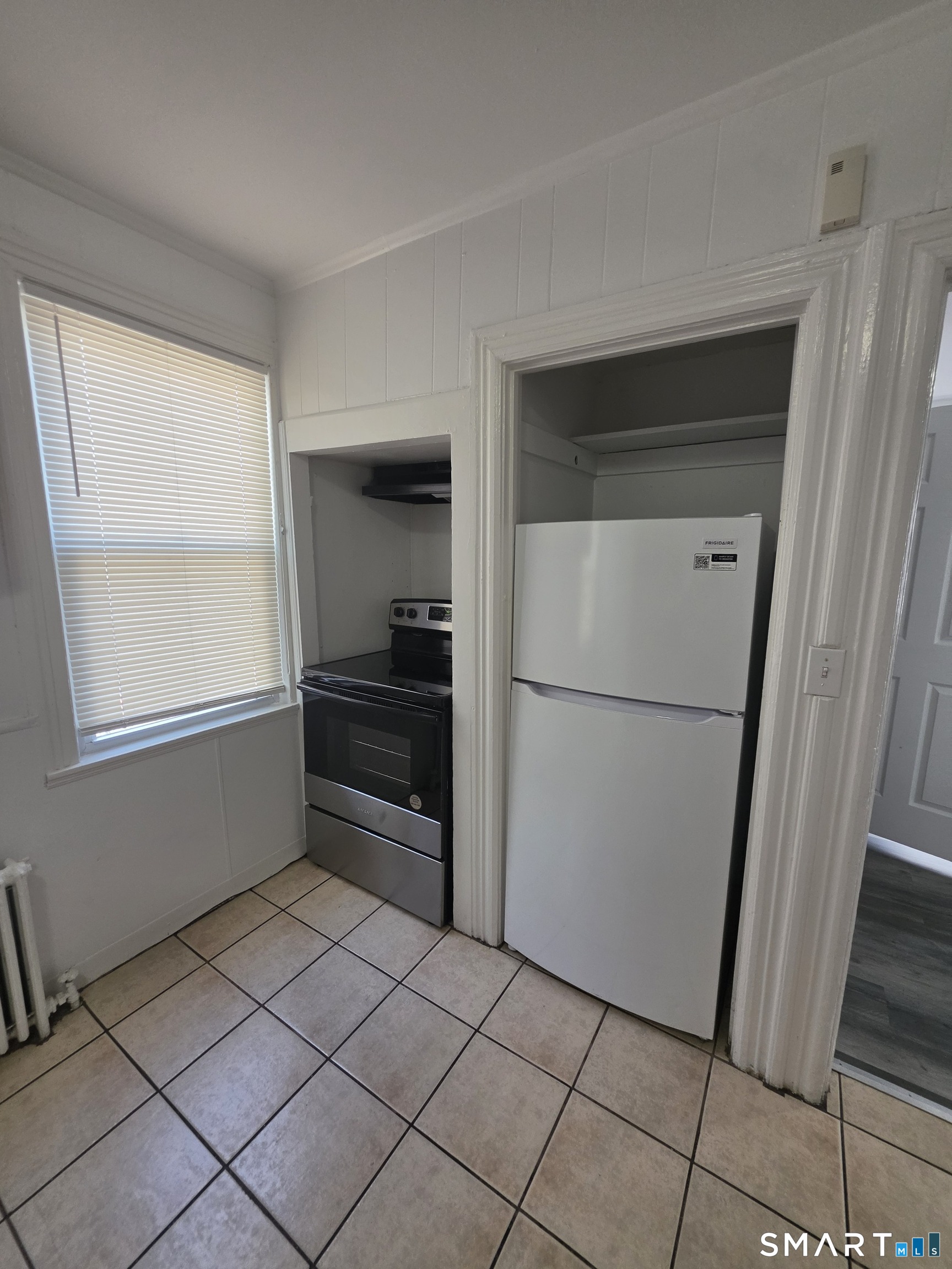 8 Mannz Street Hartford, CT 06114 - Photo 14 of 22 a kitchen with a refrigerator and a sink