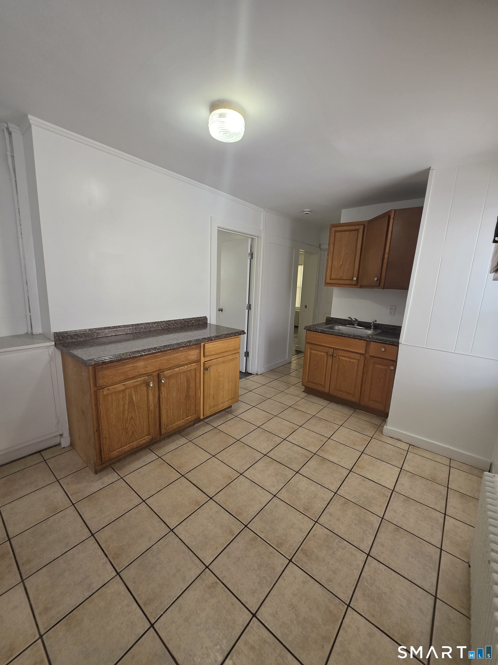 8 Mannz Street Hartford, CT 06114 - Photo 16 of 22 a room with a cabinets and a fireplace