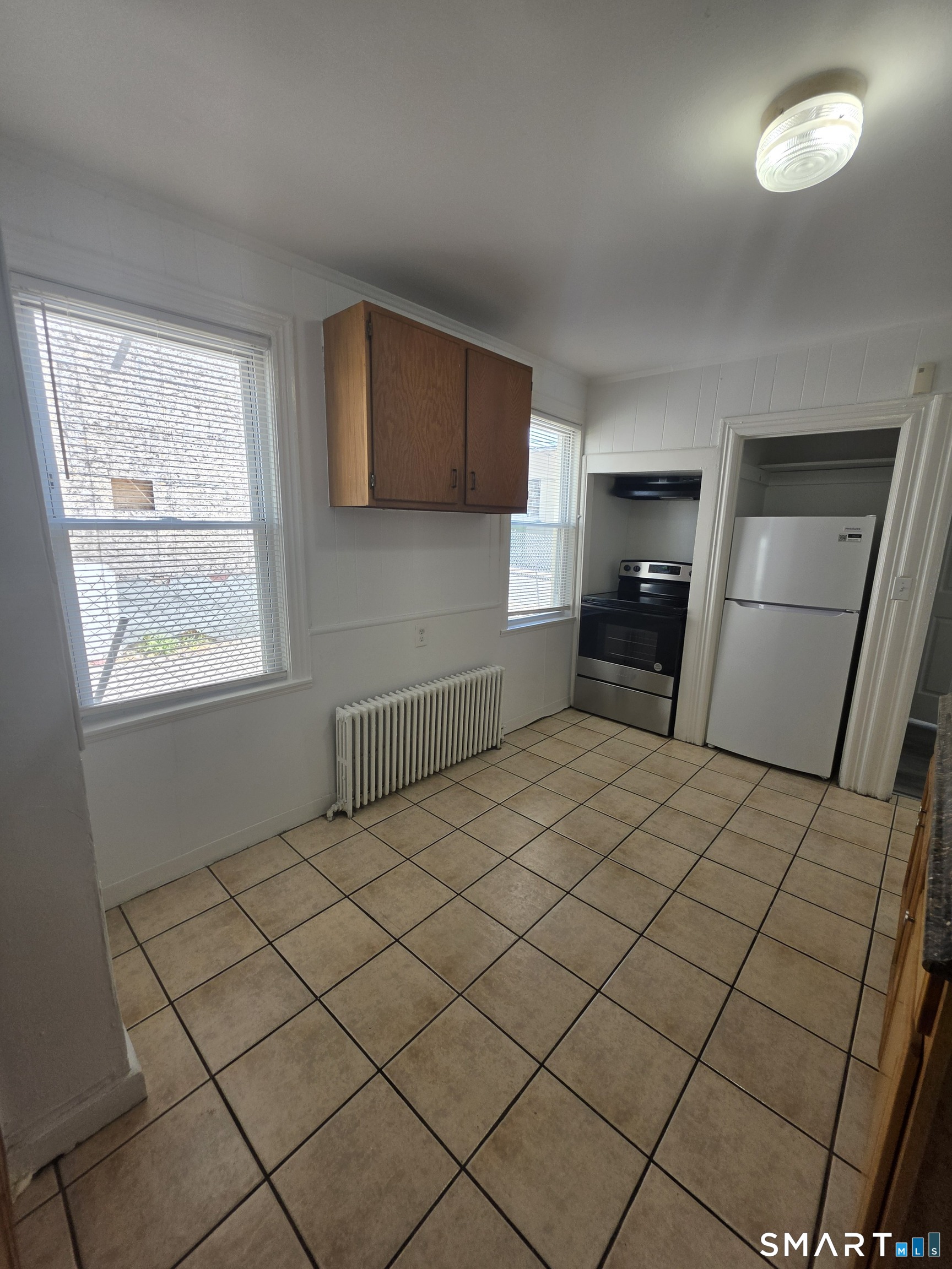 8 Mannz Street Hartford, CT 06114 - Photo 17 of 22 a room with a bed and a window