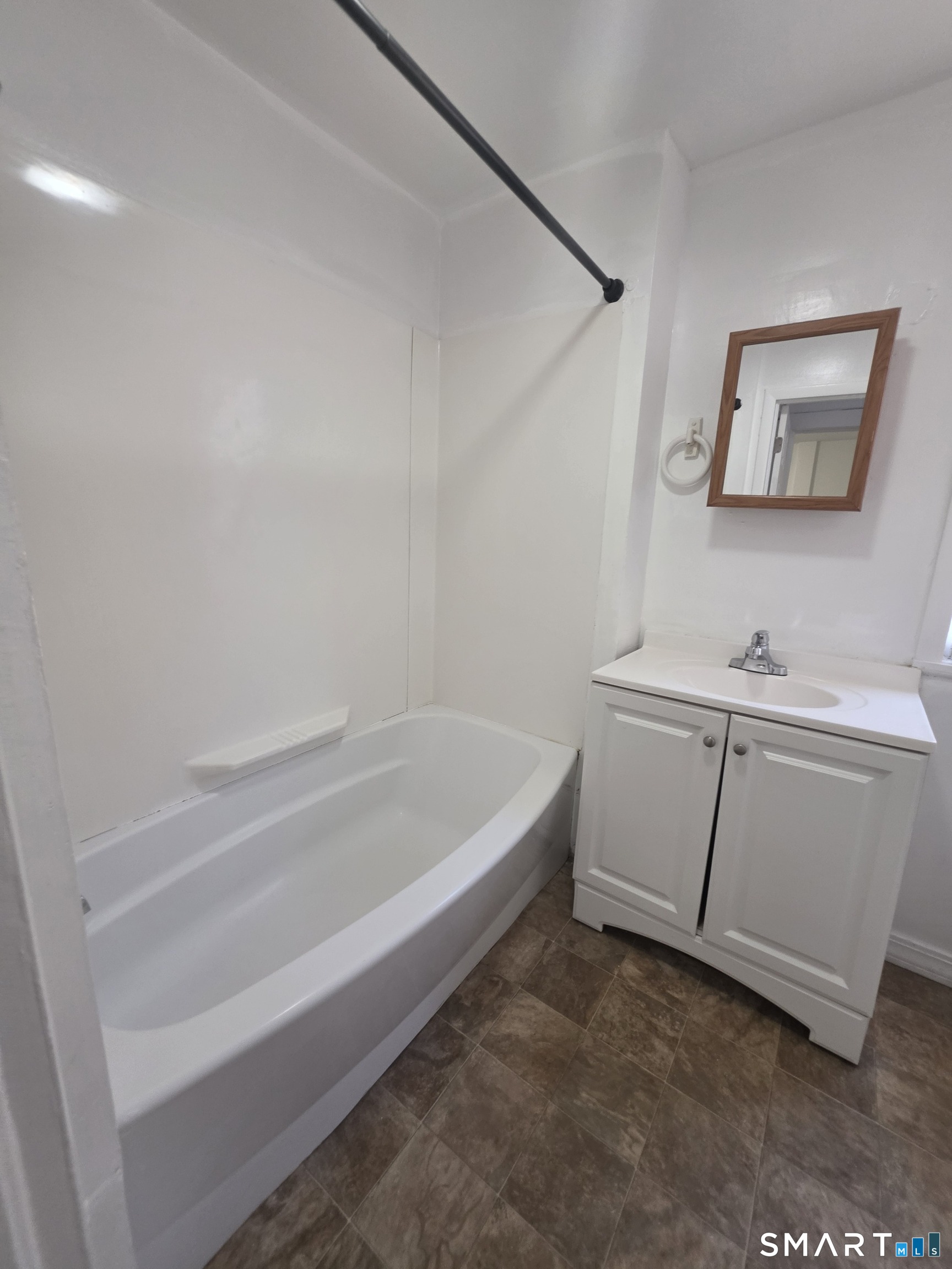 8 Mannz Street Hartford, CT 06114 - Photo 21 of 22 a spacious bathroom with a bathtub and shower