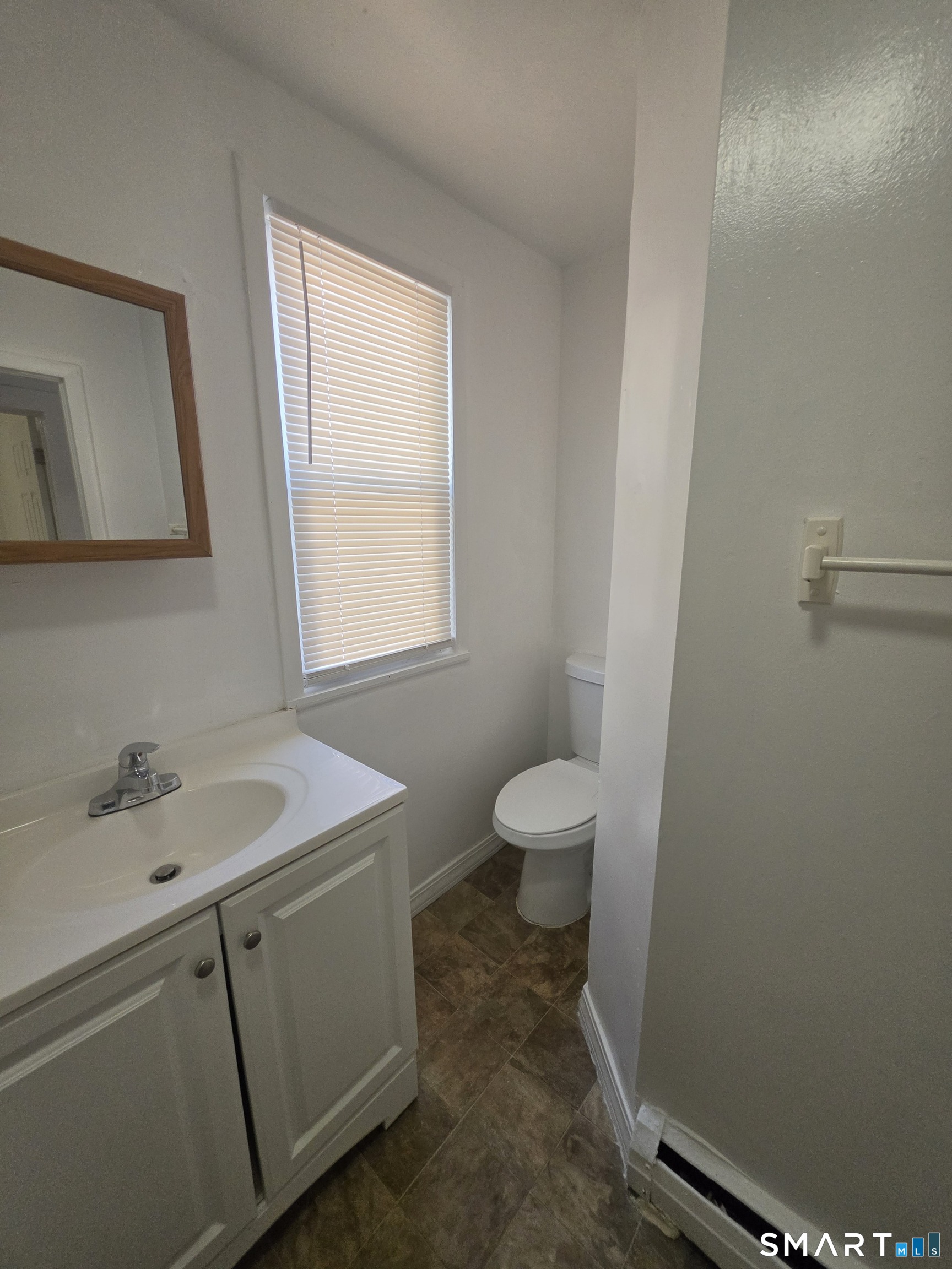 8 Mannz Street Hartford, CT 06114 - Photo 22 of 22 a bathroom with a sink toilet and window