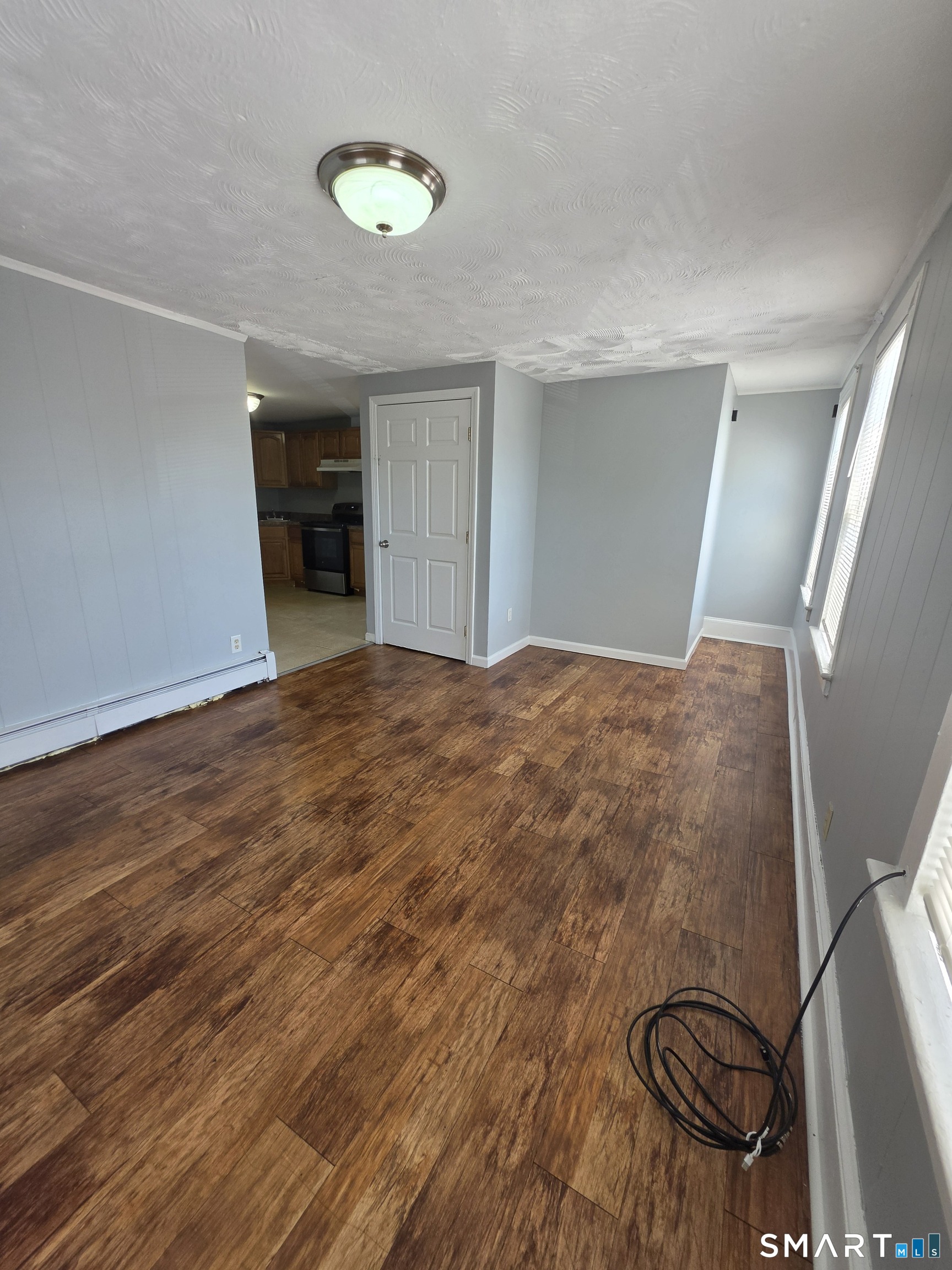 8 Mannz Street Hartford, CT 06114 - Photo 6 of 22 a view of livingroom with furniture and staircase