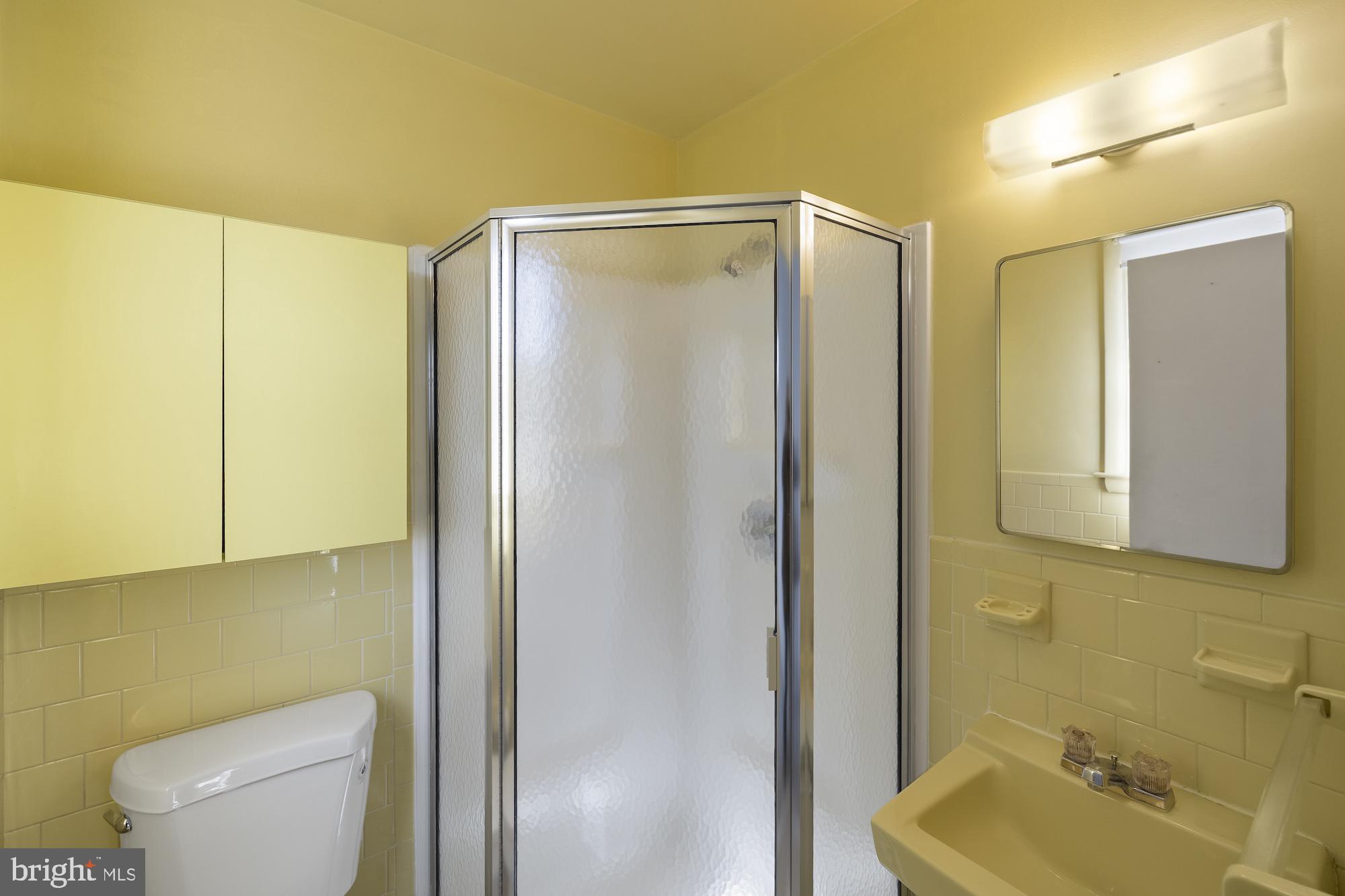 8605 Lucerne Road Randallstown, MD 21133 - Photo 17 of 30 a bathroom with a shower a toilet and sink